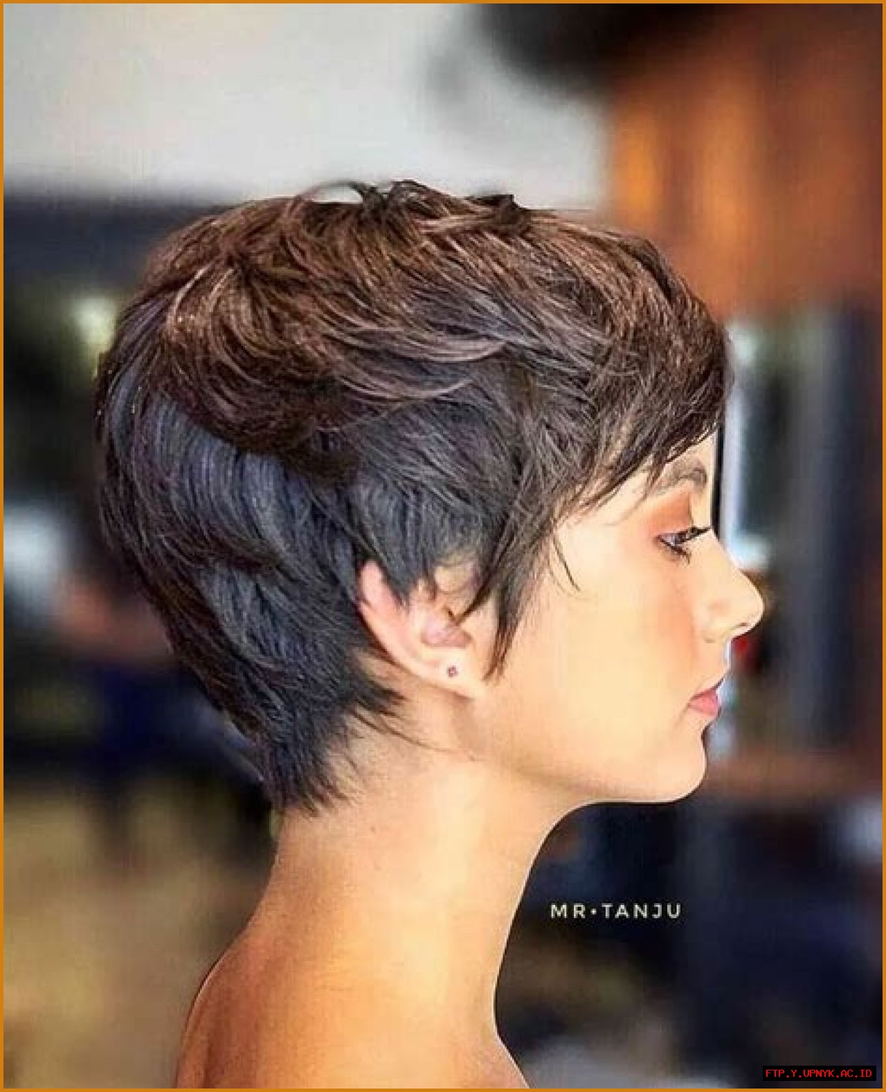 Enchanting Long Pixie Cut With Elongated Bangs: A Timeless Hairstyle