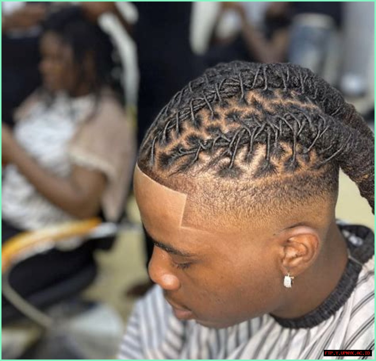 Uplevel Your Style: Dread Updo Inspiration For Men
